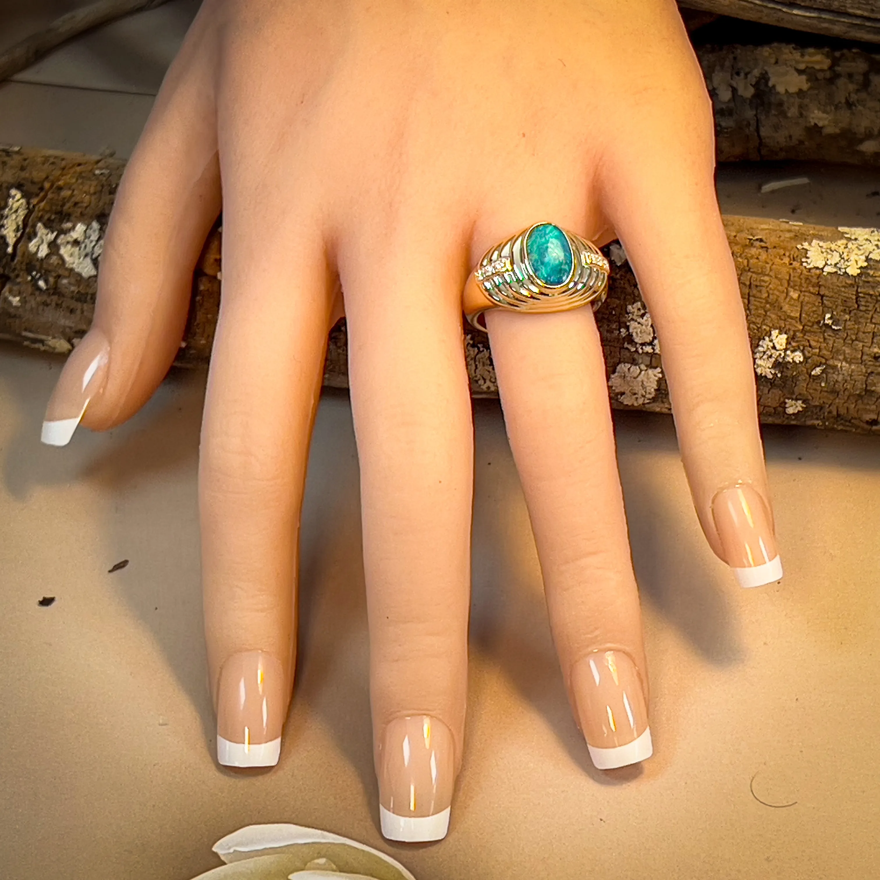 14kt Yellow Gold raised setting Black Opal and diamond ring