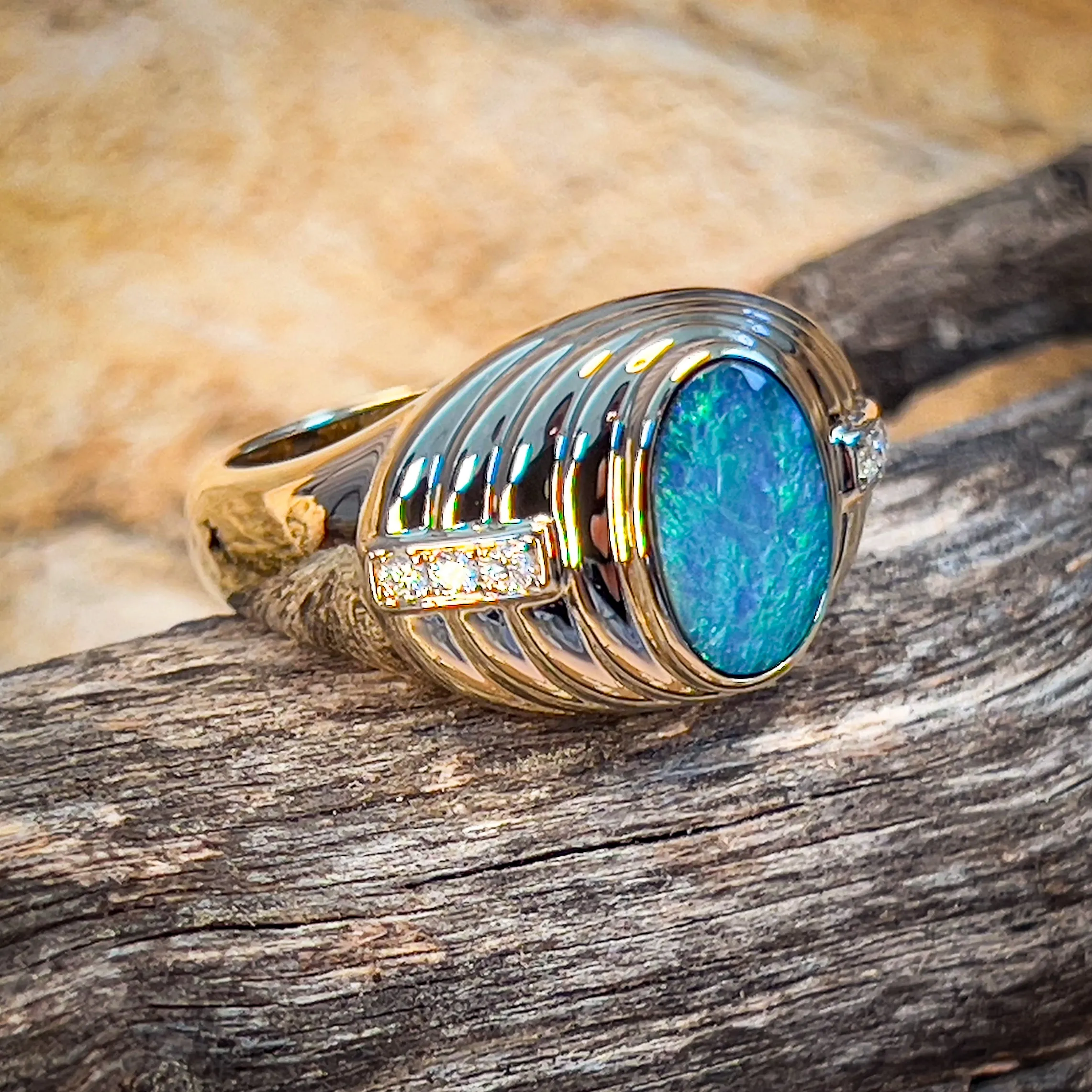 14kt Yellow Gold raised setting Black Opal and diamond ring
