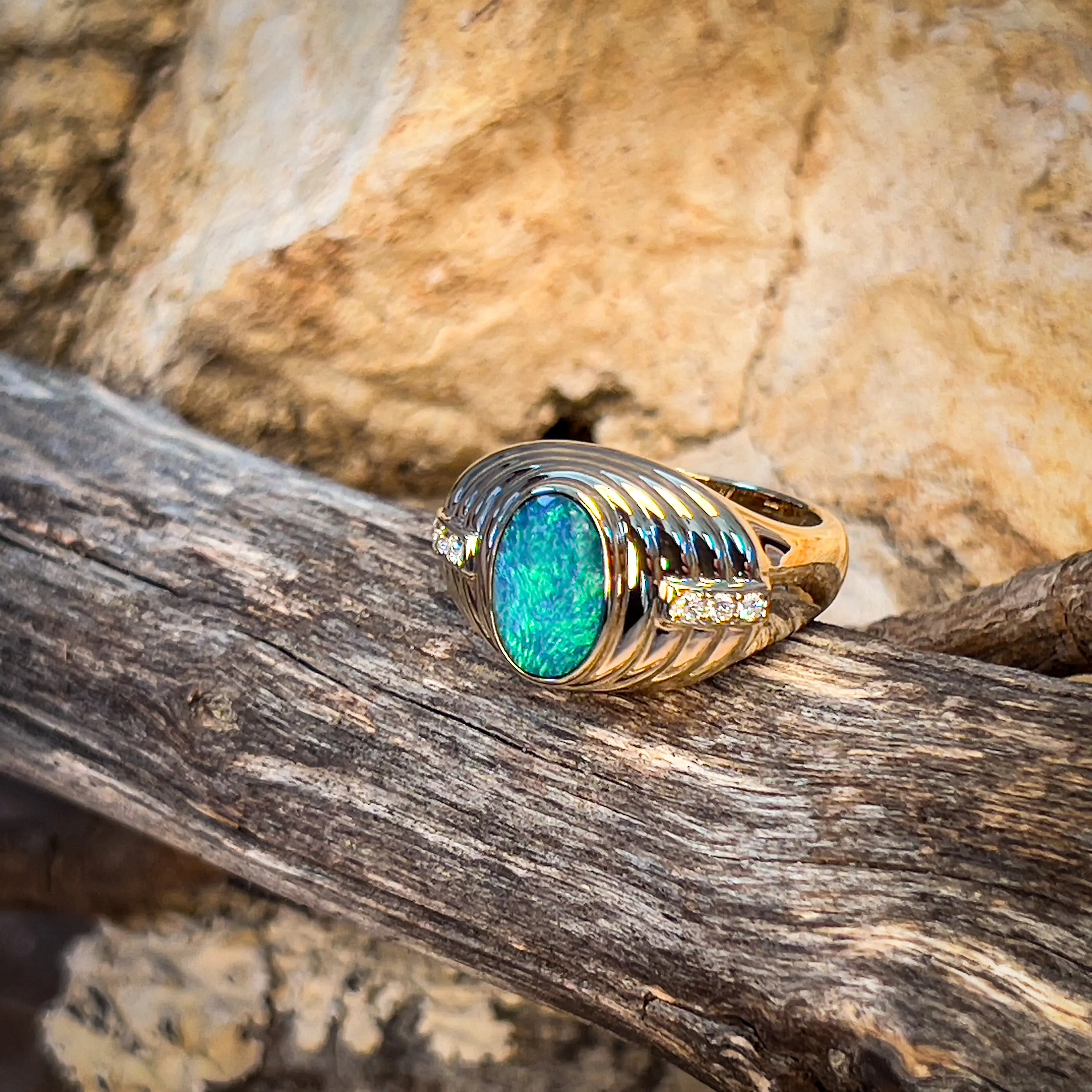 14kt Yellow Gold raised setting Black Opal and diamond ring
