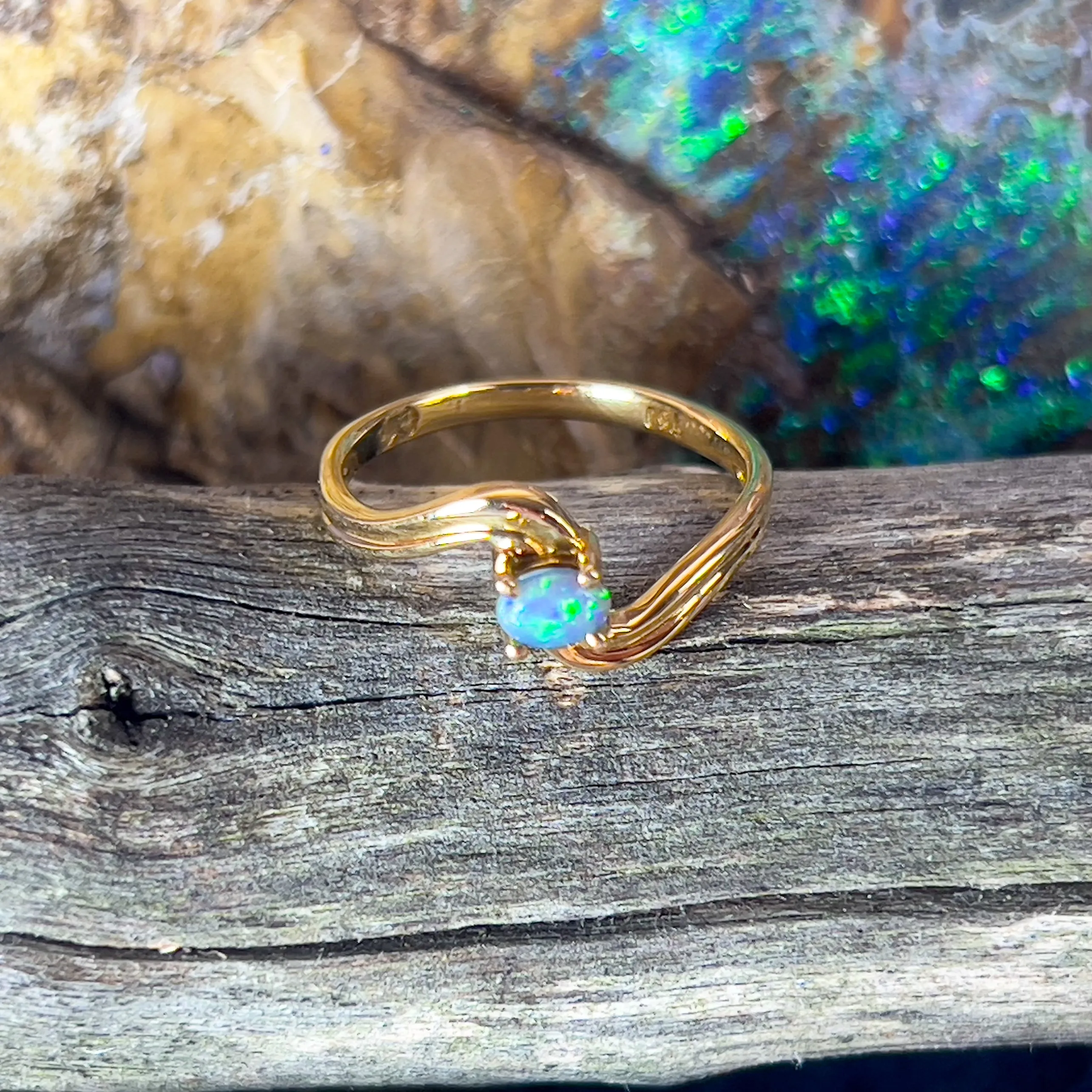 18kt Yellow Gold cross over black opal 0.15ct ring