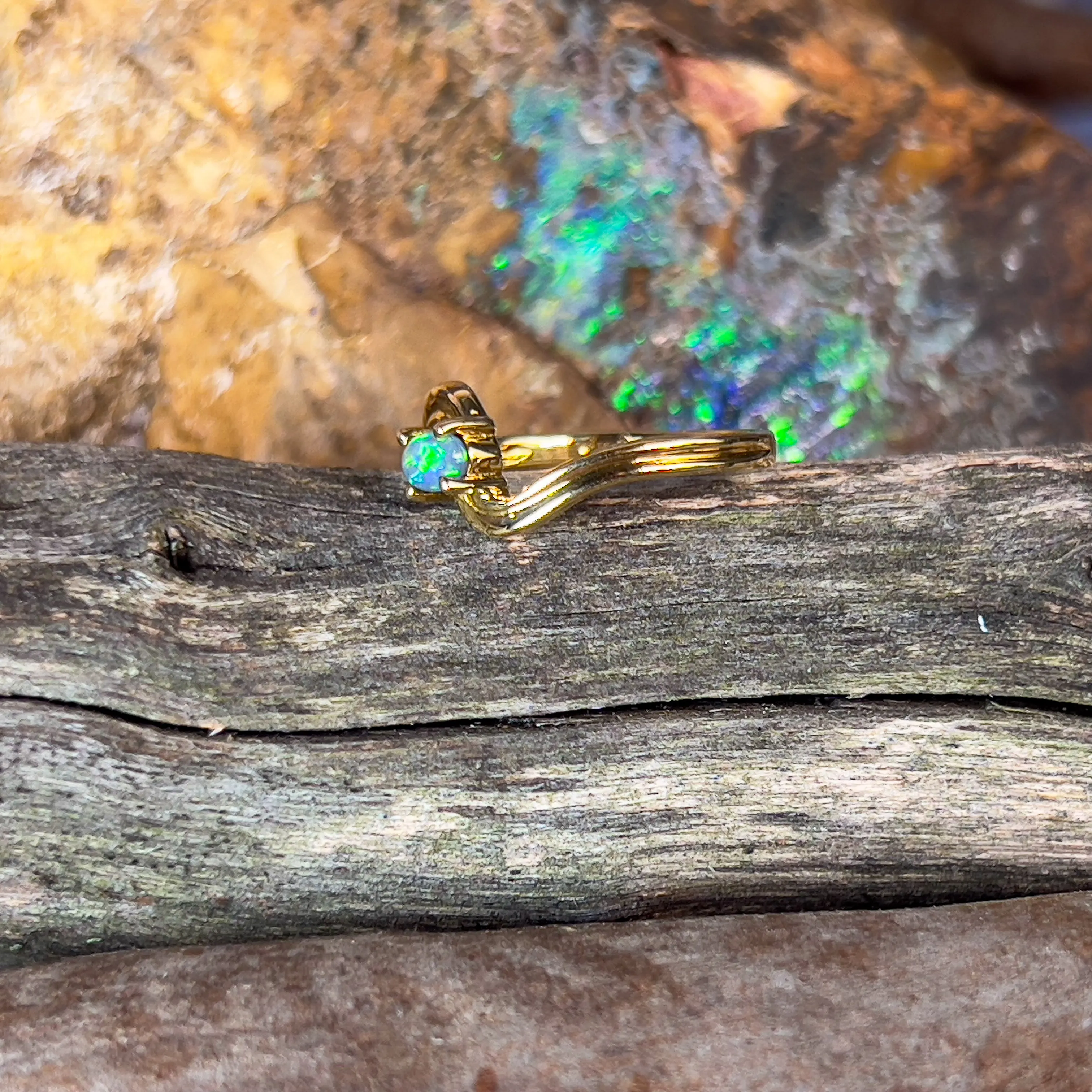 18kt Yellow Gold cross over black opal 0.15ct ring