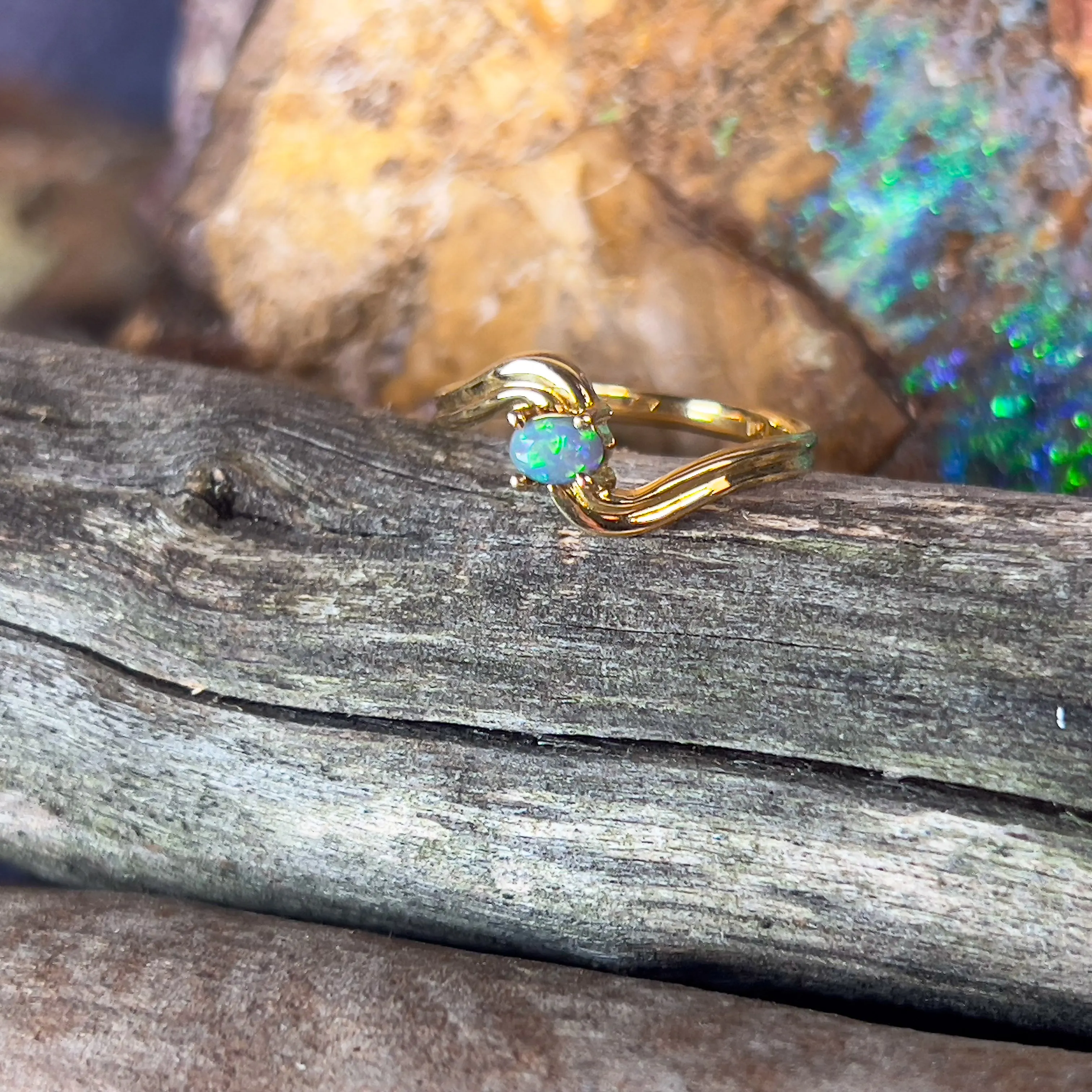 18kt Yellow Gold cross over black opal 0.15ct ring