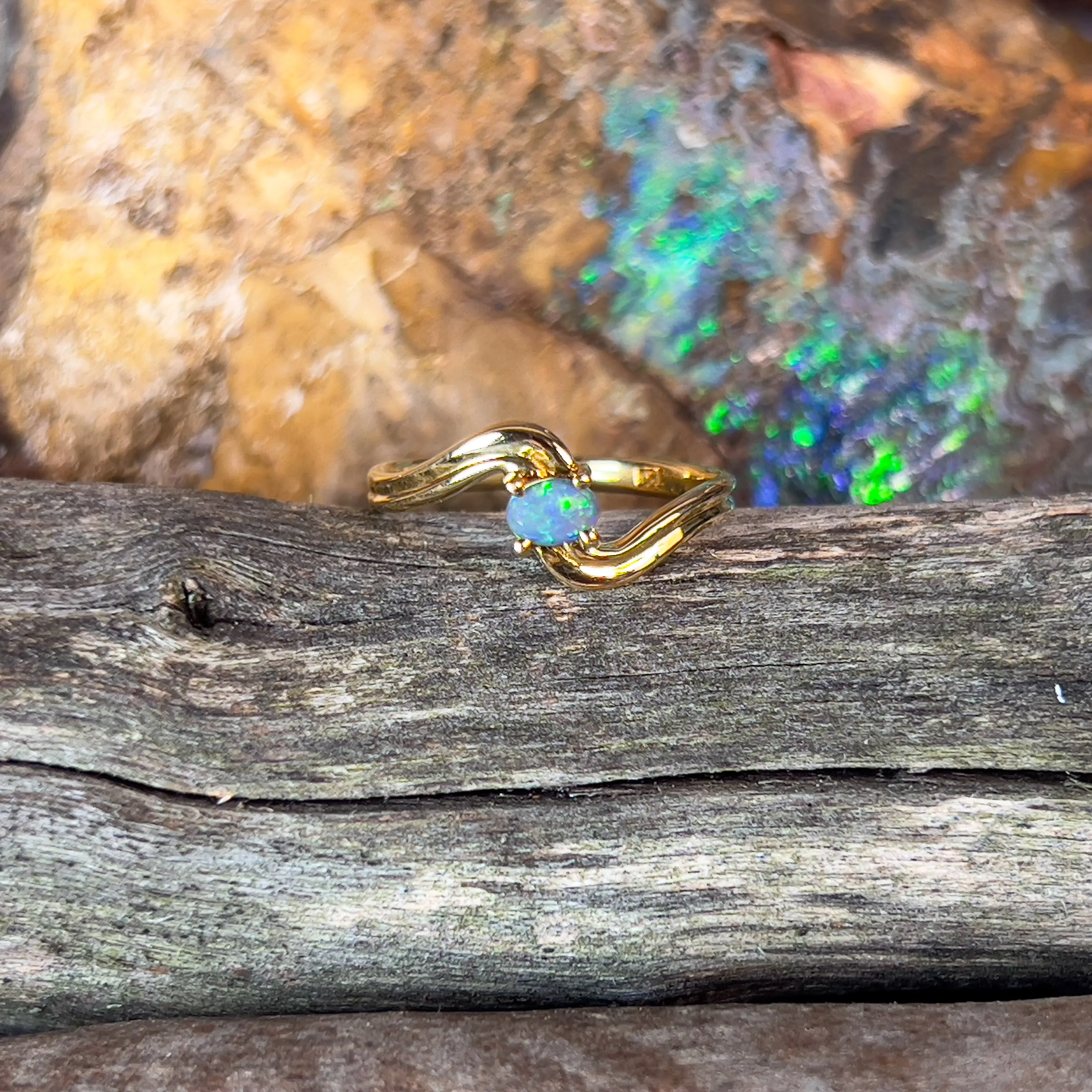 18kt Yellow Gold cross over black opal 0.15ct ring