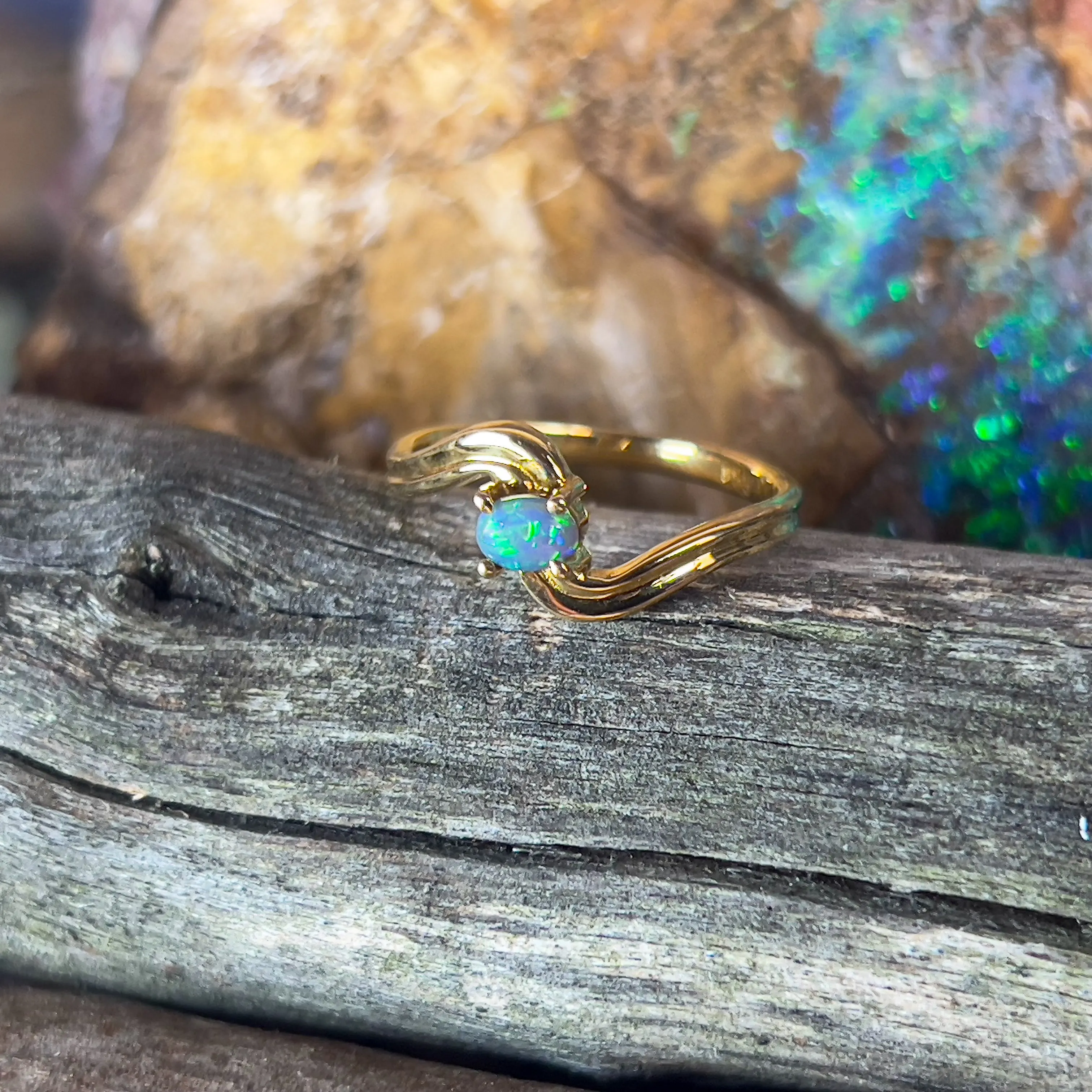 18kt Yellow Gold cross over black opal 0.15ct ring
