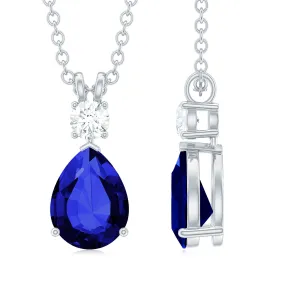 Created Blue Sapphire and Moissanite Modern Teardrop Pendant in Silver