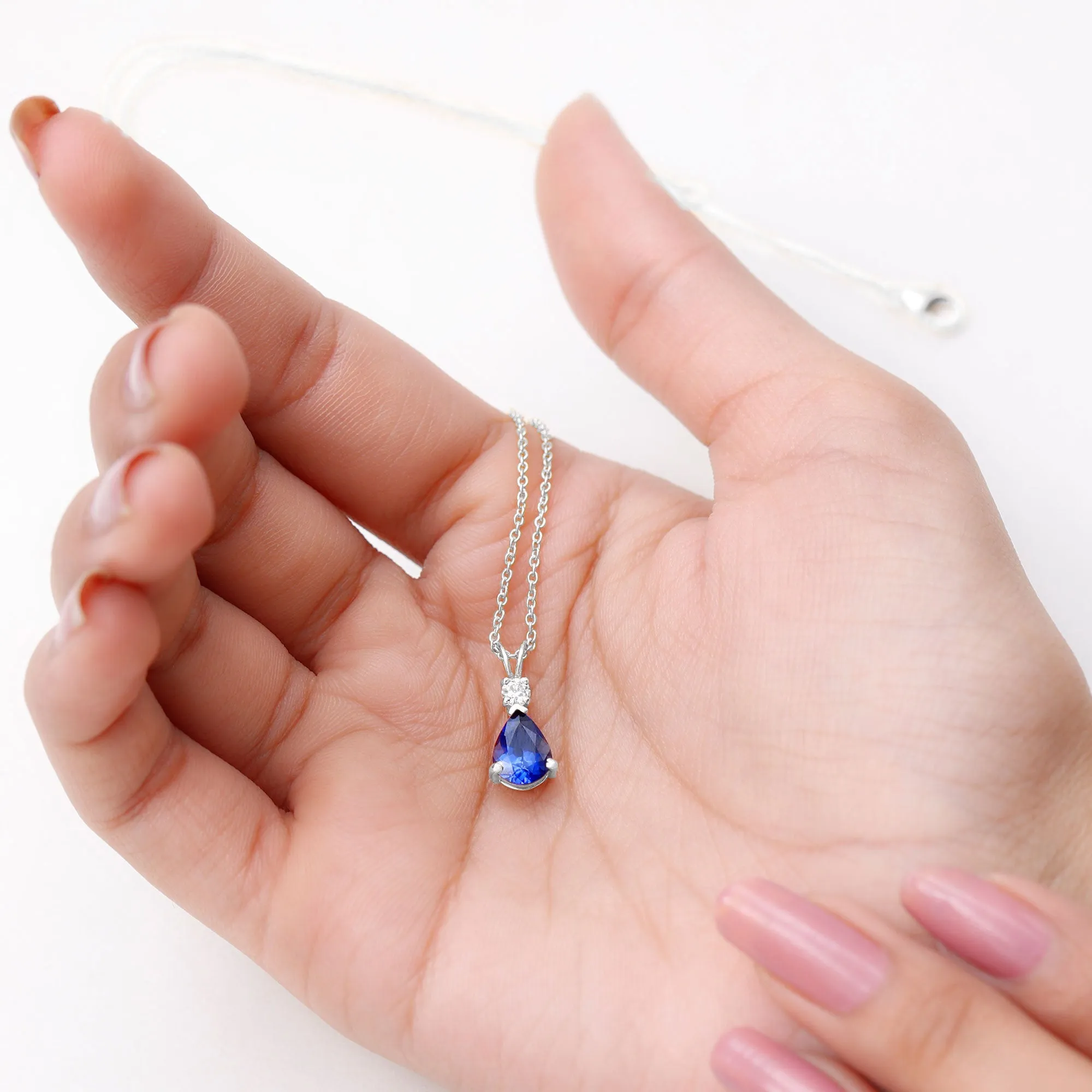 Created Blue Sapphire and Moissanite Modern Teardrop Pendant in Silver
