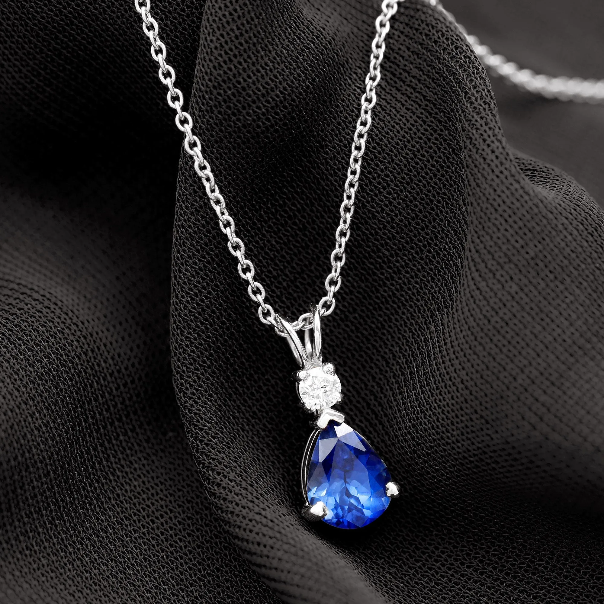 Created Blue Sapphire and Moissanite Modern Teardrop Pendant in Silver